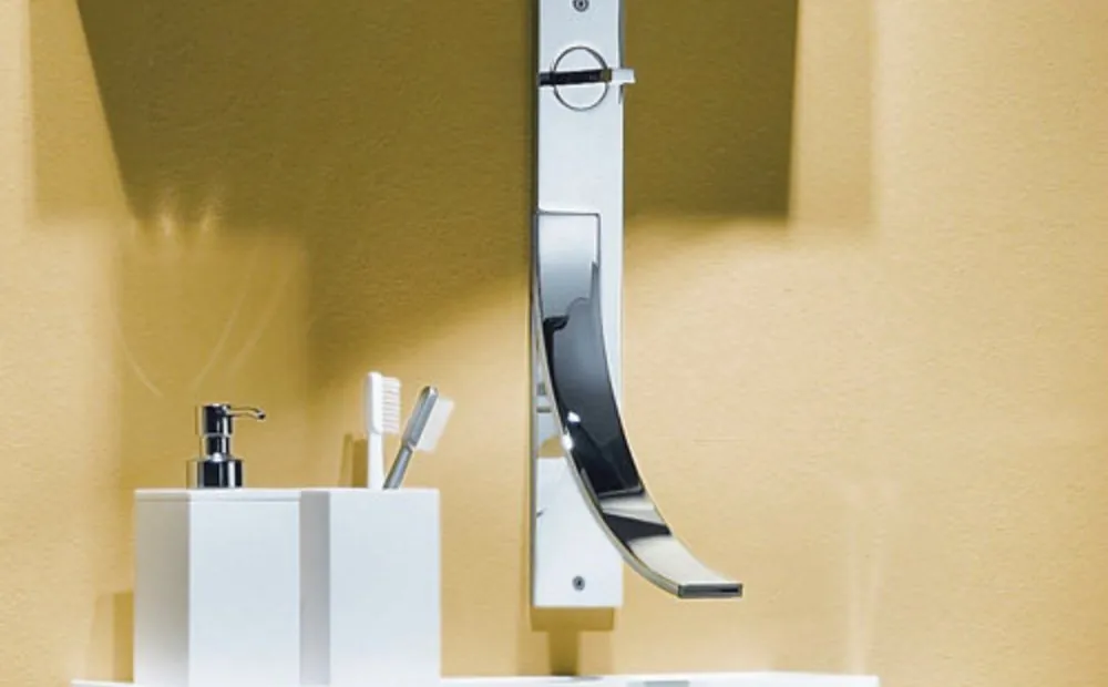 Designer wall-mounted tap in a bathroom