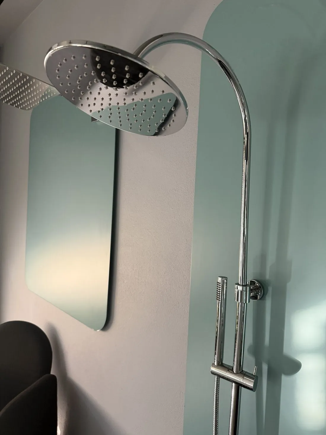 Chrome shower column in a modern bathroom